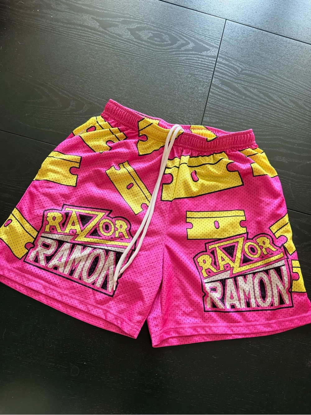WWE Chalk Line Razor Ramon Men’s Athletic Mesh Shorts in Pink & Yellow